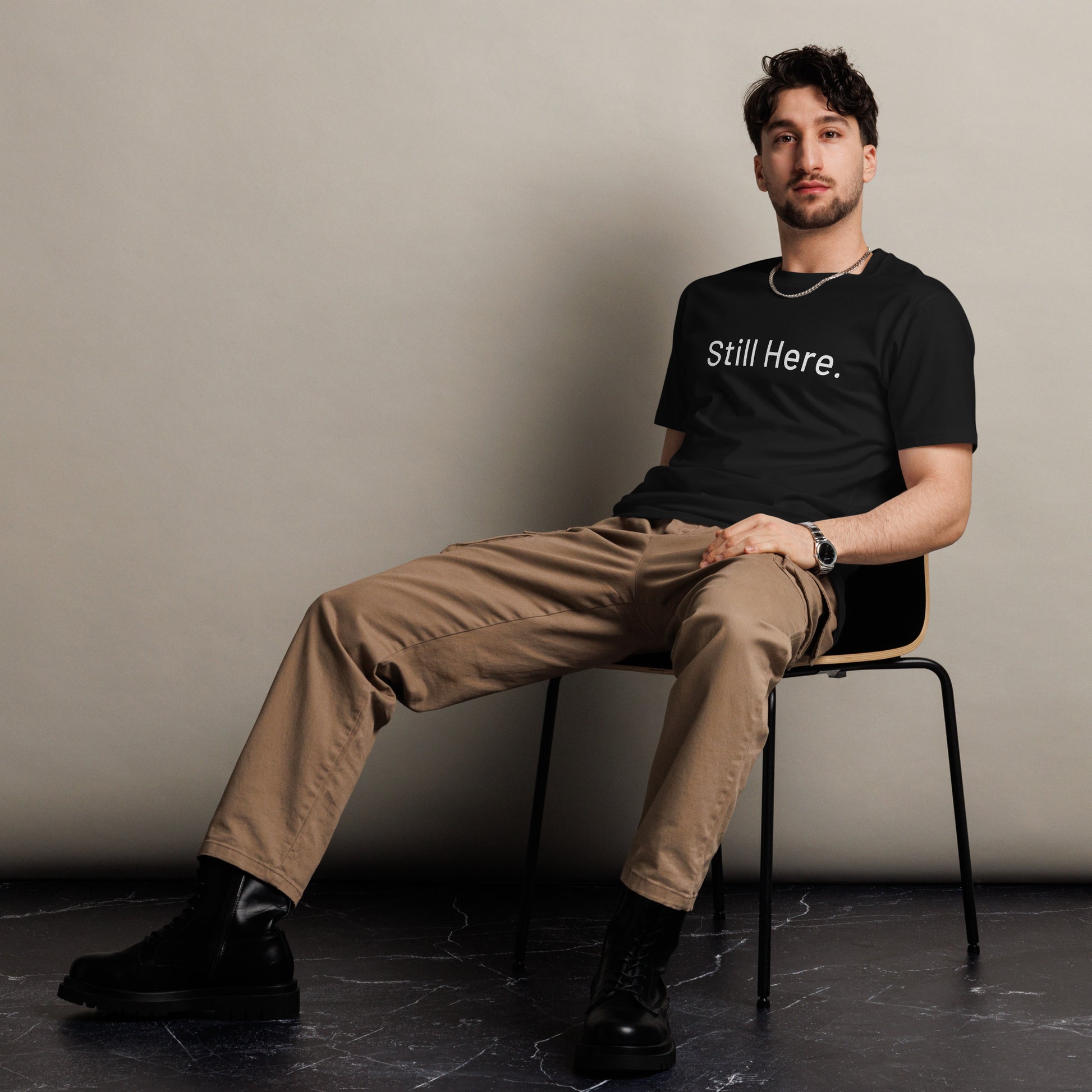 Still Here Co. unisex tee in black — quiet strength statement shirt