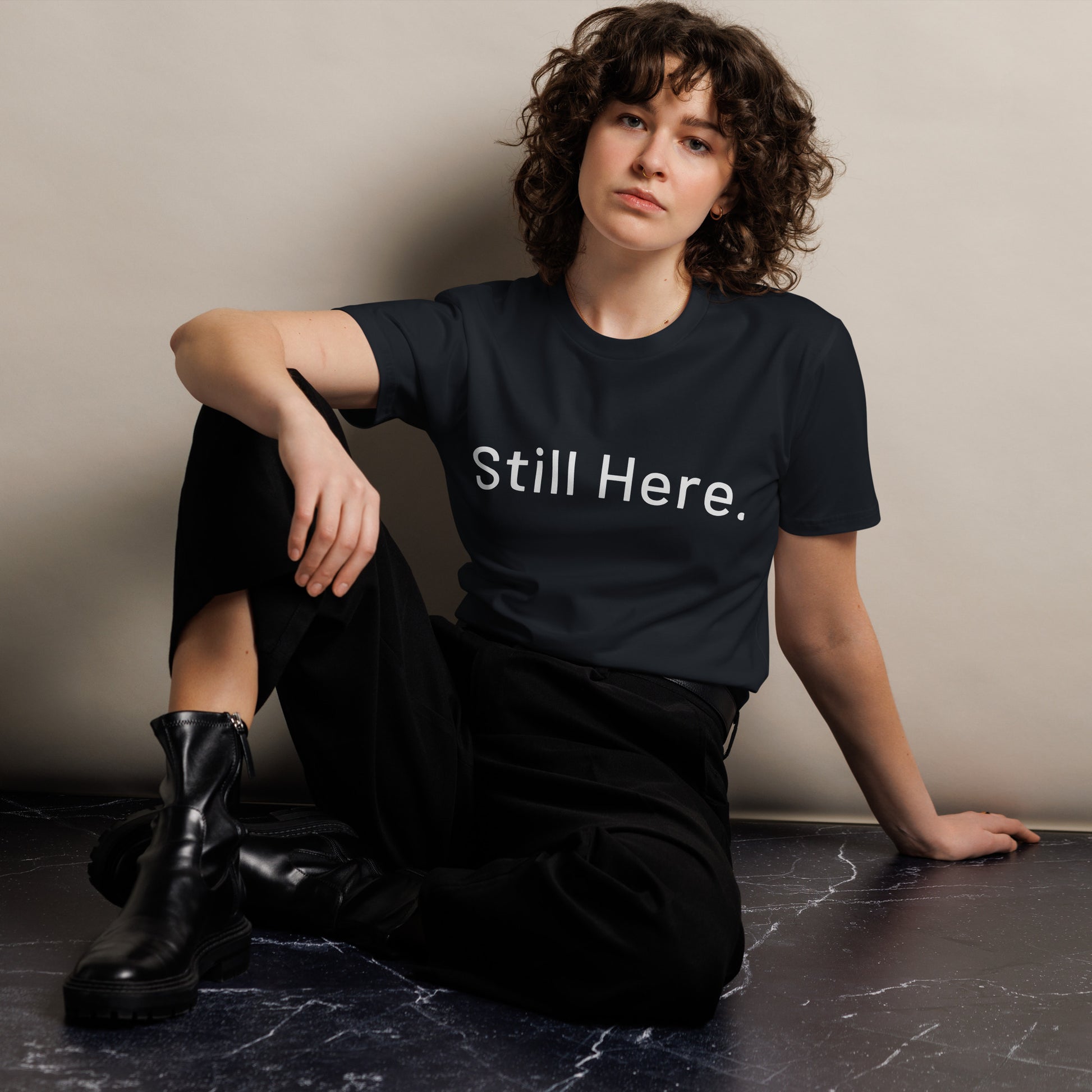 Still Here Co. unisex tee in navy — Still Here. front text print